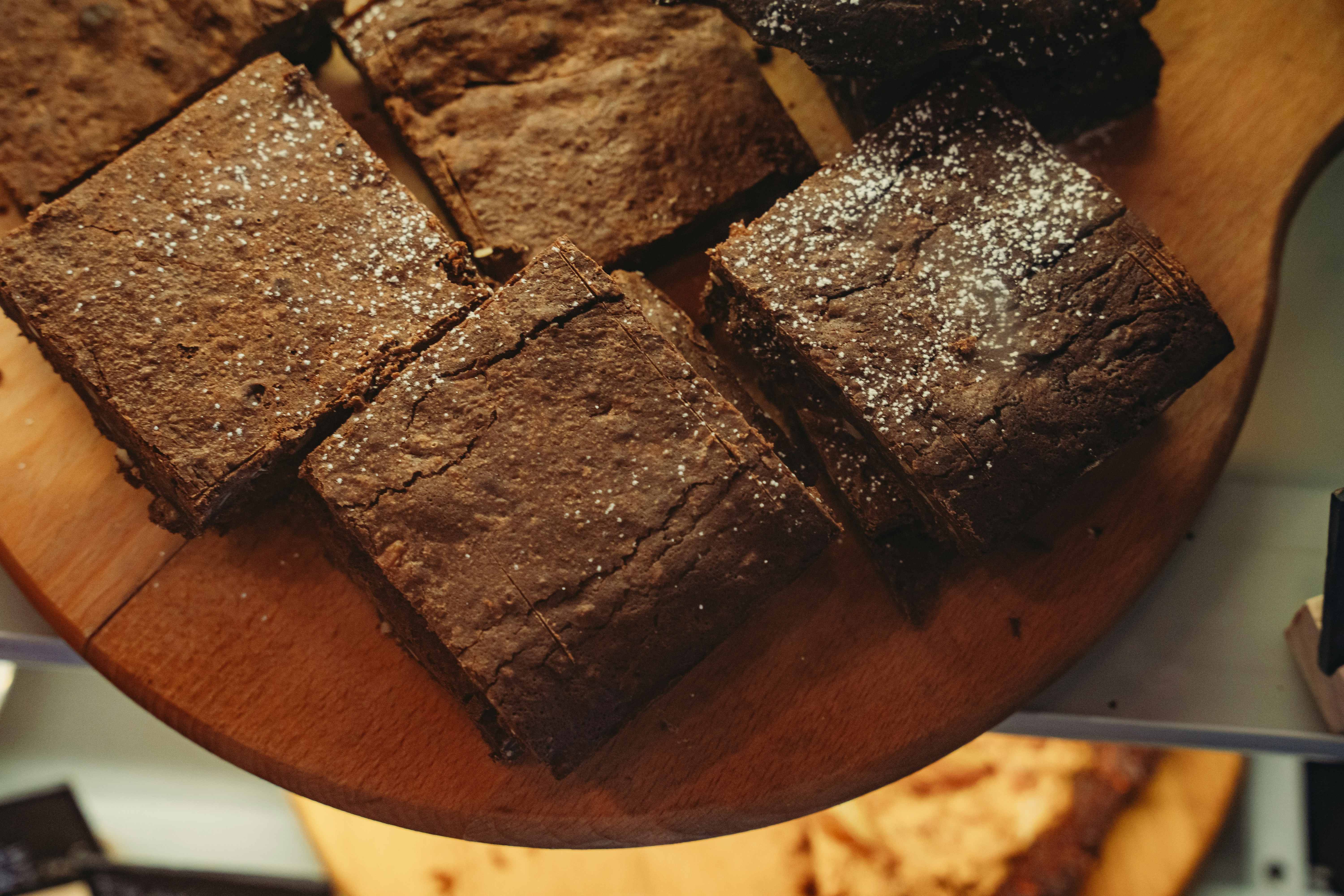 Freshly baked brownies on a wooden board